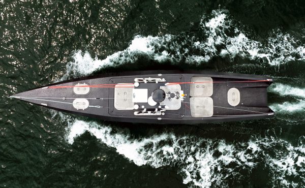 Aerial view of the Oceanus12 autonomous surface vessel underway at sea, showcasing its uncrewed design and advanced AI-powered maritime autonomy platform.