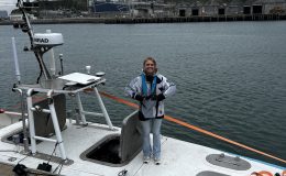 Marine AI team member working aboard an autonomous vessel during harbour operations